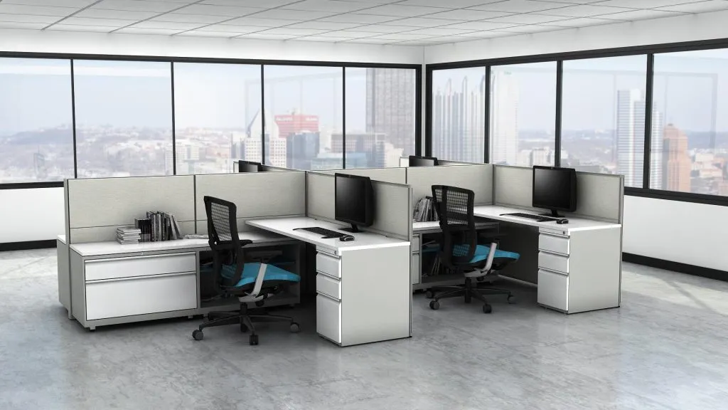 2 cubicles with desks and chairs